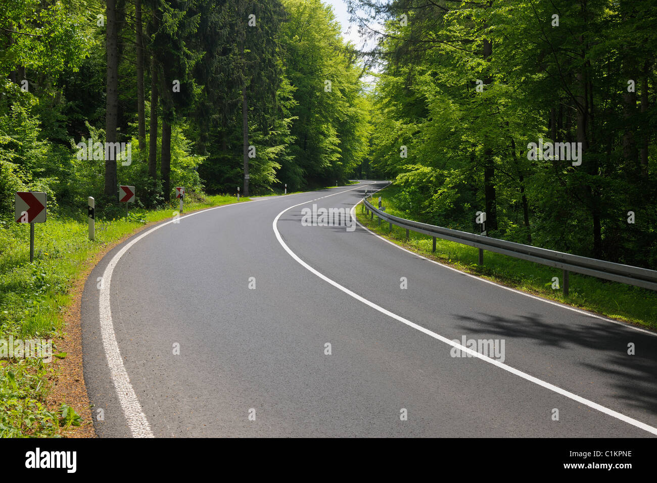Road in Springtime, Oberbessenbach, Spessart, Bavaria, Germany Stock Photo