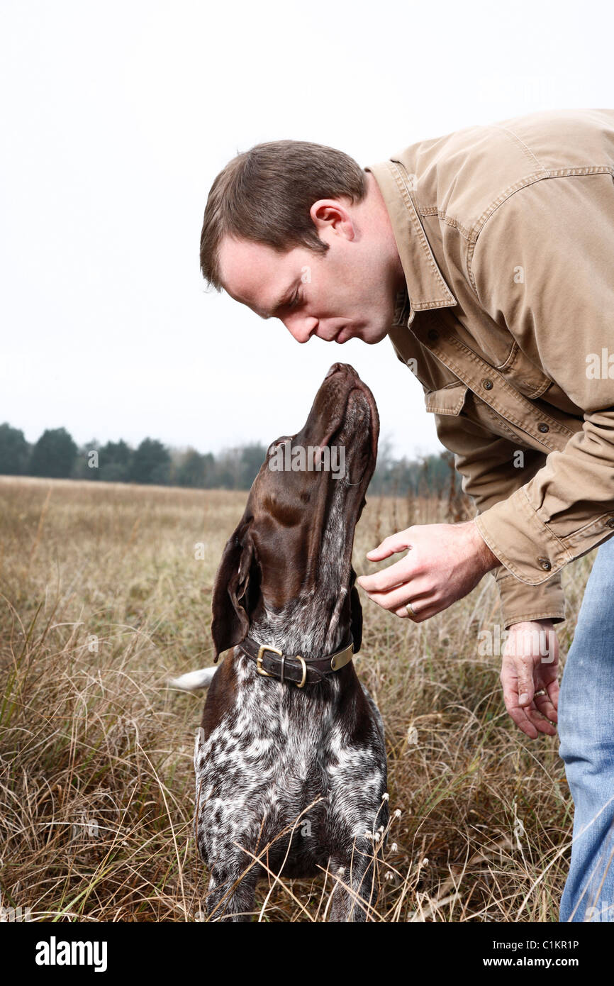 Dog Giving Owner a Kiss, Houston, Texas, USA Stock Photo