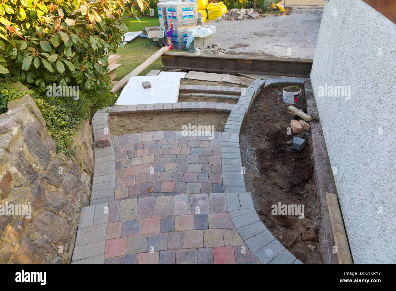 Laying block paving garden steps Stock Photo