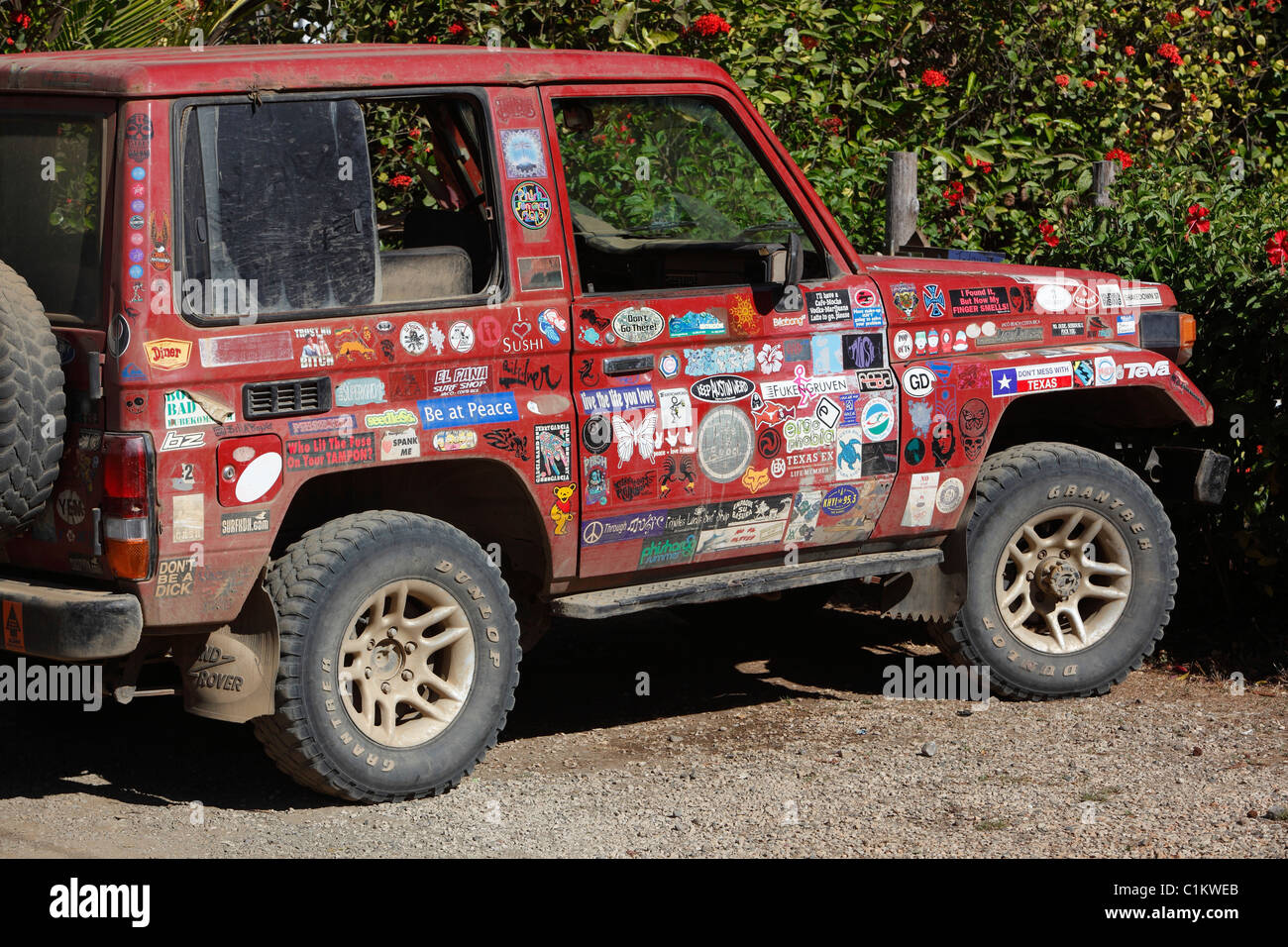 4x4 surfer's vehicle covered in bumper stickers Stock Photo