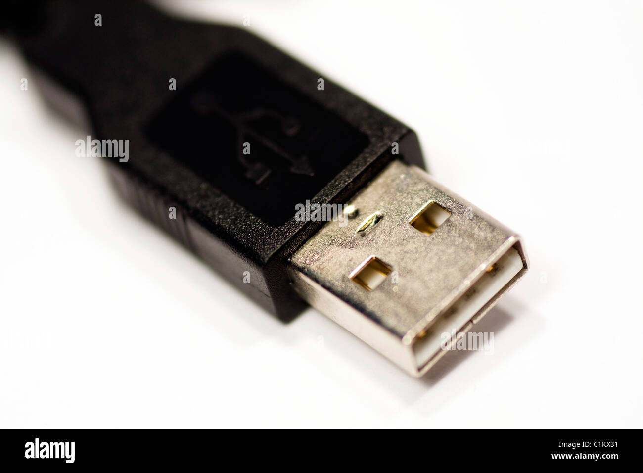Closeup view of a black USB connection cable isolated on a white background. Stock Photo
