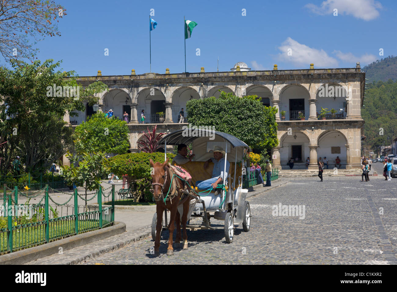 Horse and carriage outside the Old Weapon Museum and Plaza Mayor, Antigua, Guatemala Stock Photo