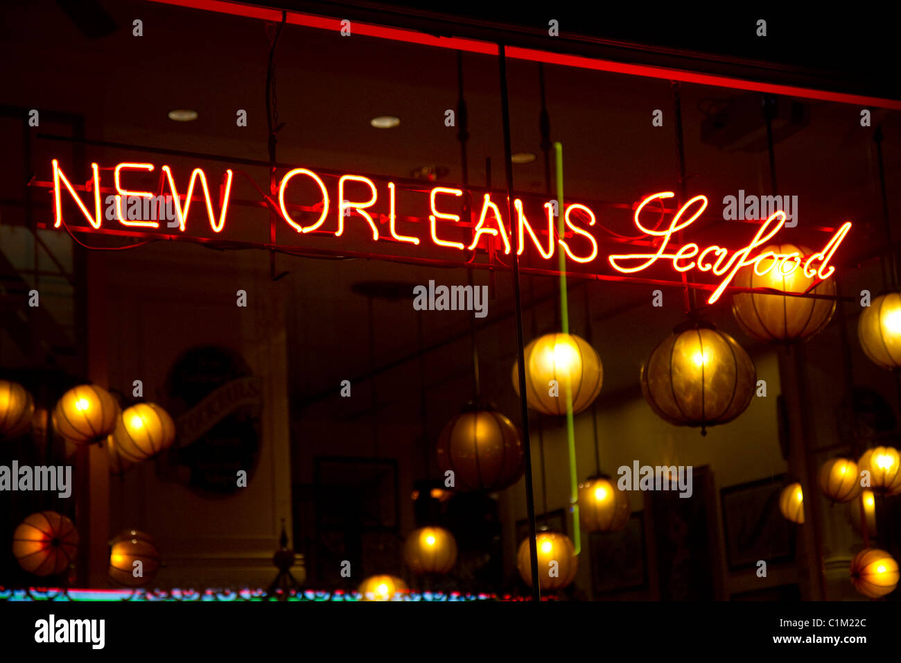 Neon sign advertising New Orleans seafood in the French Quarter of New Orleans, Louisiana, USA. Stock Photo