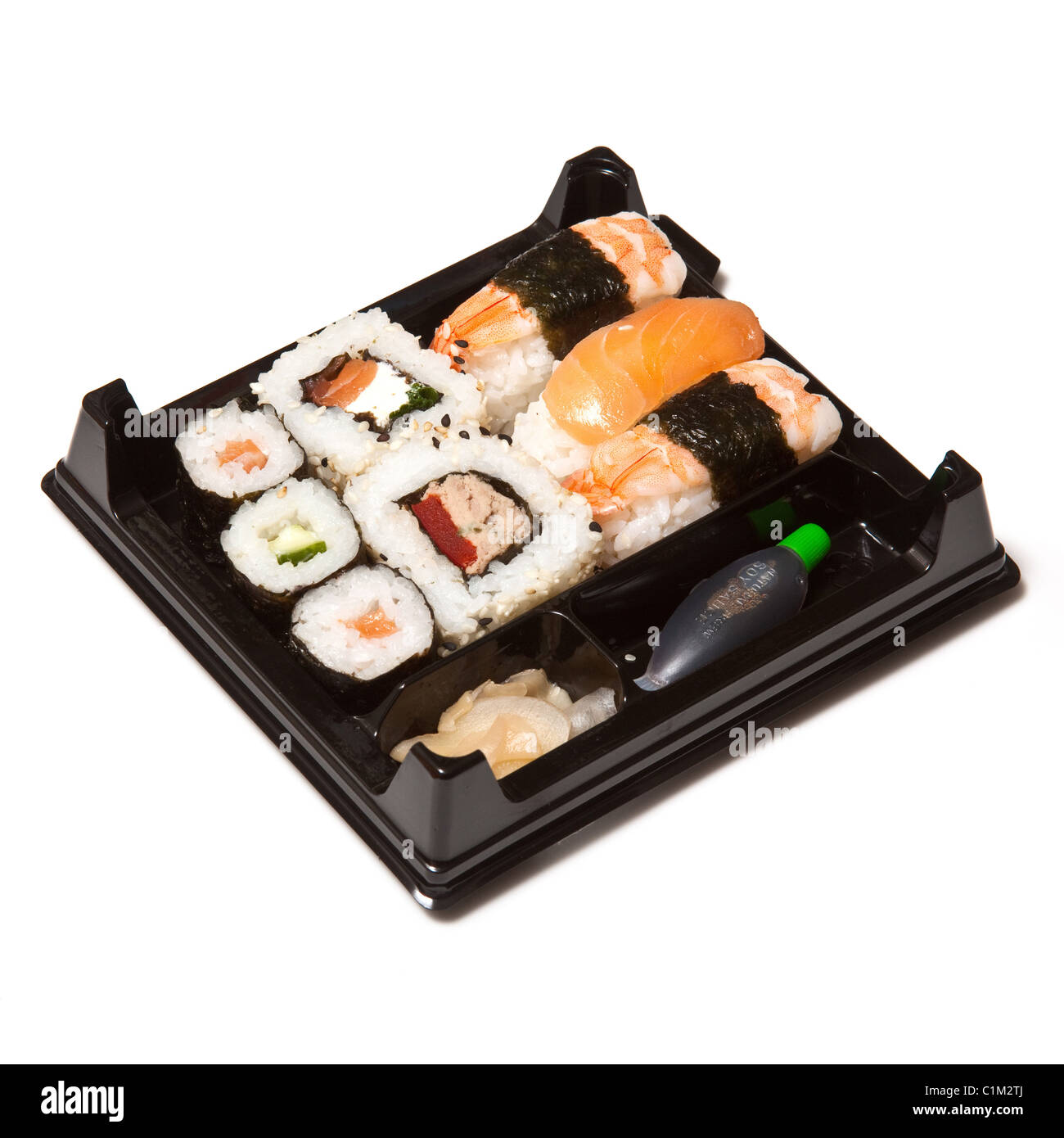 Sushi takeaway tray isolated on a white studio background. Stock Photo