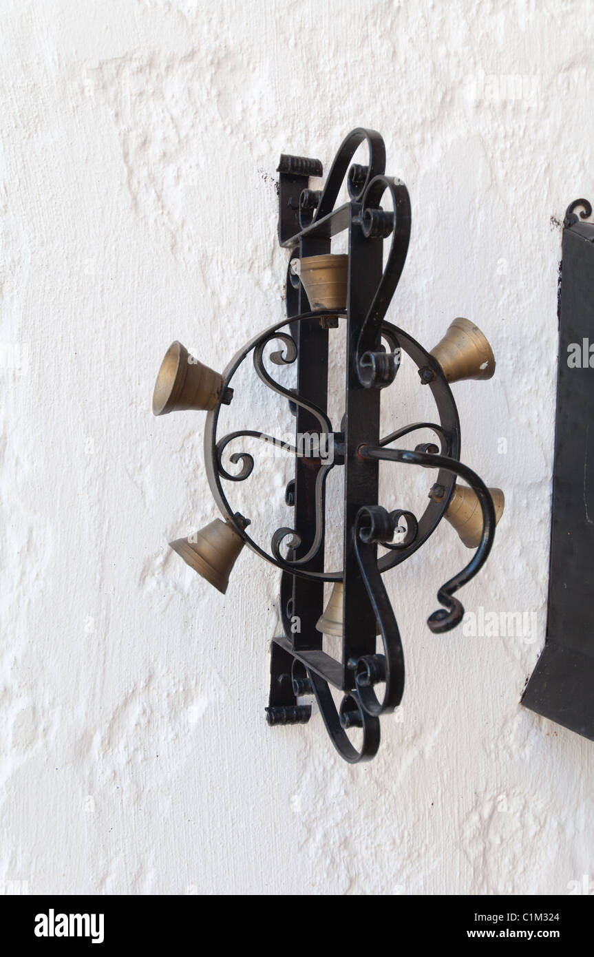 Hand-cranked chimes serve as doorbells for a Greek Monastery near the city of Nafpaktos. Stock Photo