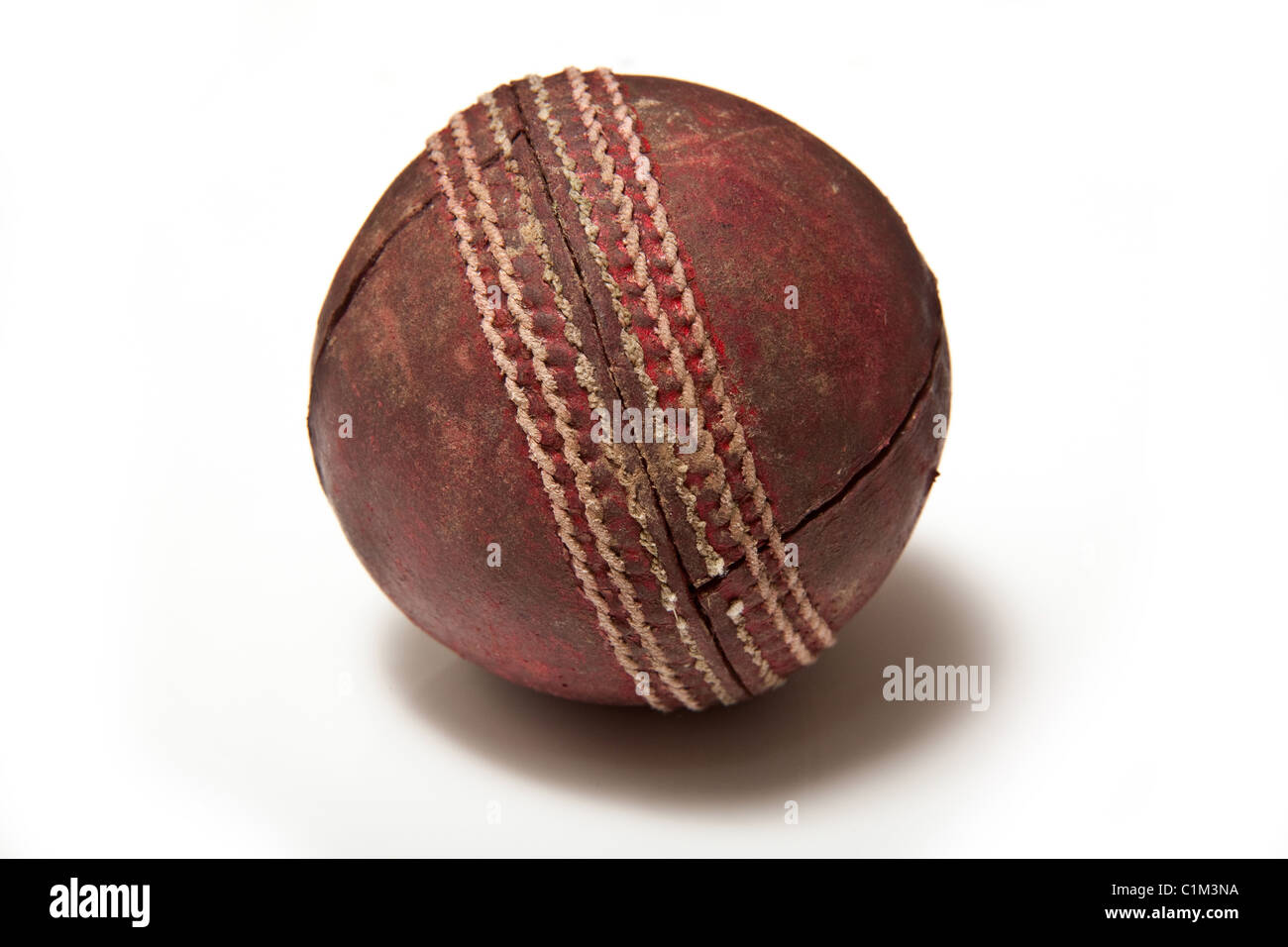 Leather cricket ball isolated on a white studio background. Stock Photo