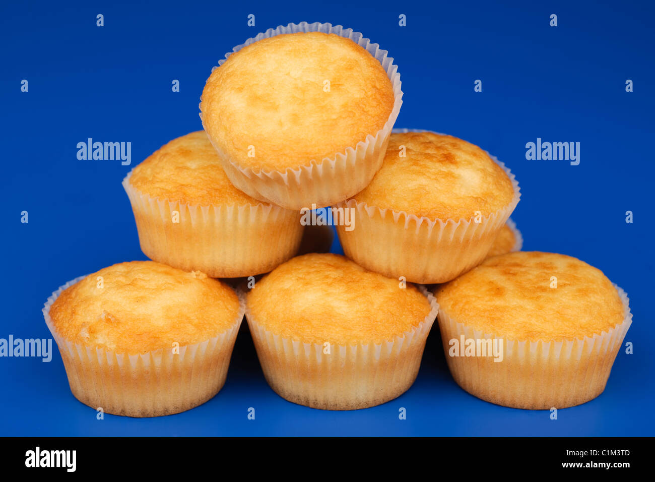 Pile of fairy cakes in cases Stock Photo