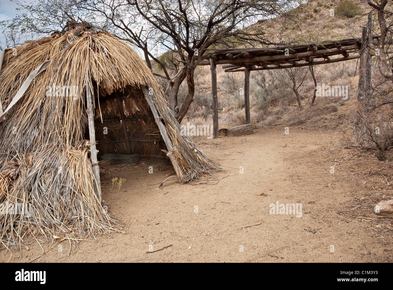 Wickiup and ramada at Chiricahua Apache Camp reconstruction near Fort Bowie, Arizona, USA Stock Photo