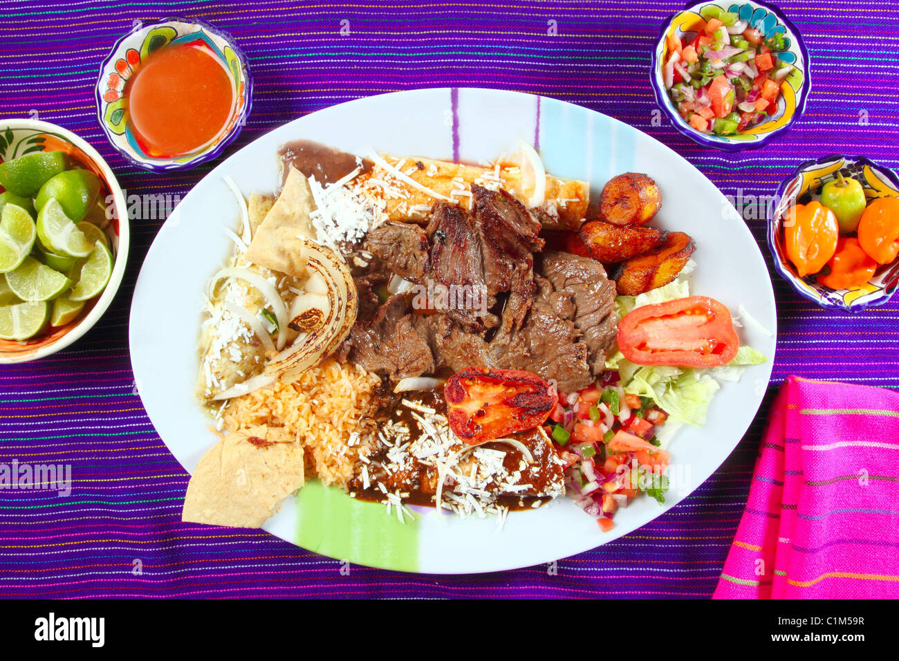Arrachera beef flank steak Mexican dish assorted chili sauces Mexico spiced Stock Photo