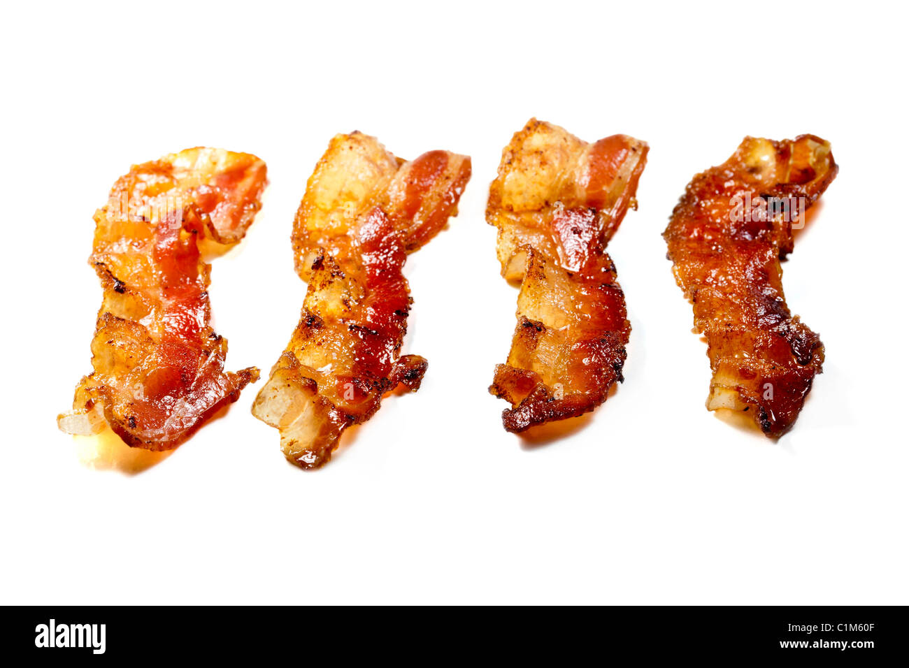 Cooked bacon isolated on white background. Charles Lupica Stock Photo