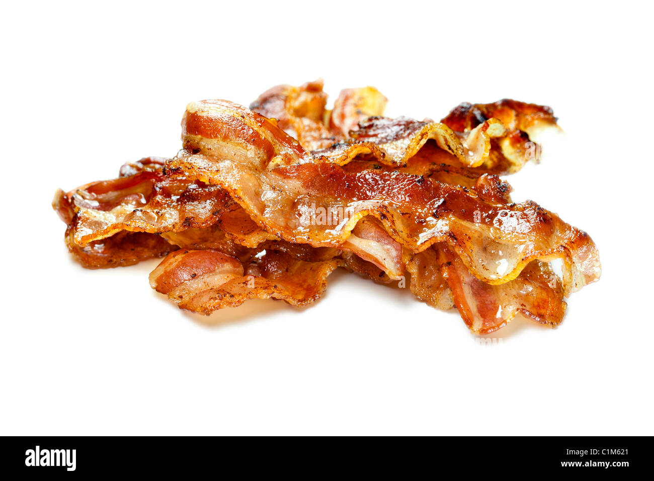 Cooked bacon isolated on white background. Charles Lupica Stock Photo
