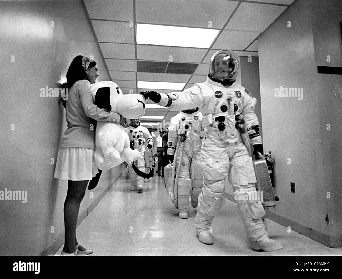 Apollo 10 crew, Thomas P. Stafford pats the nose of Snoopy, the mission's mascot, held by Jamye Flowers Stock Photo