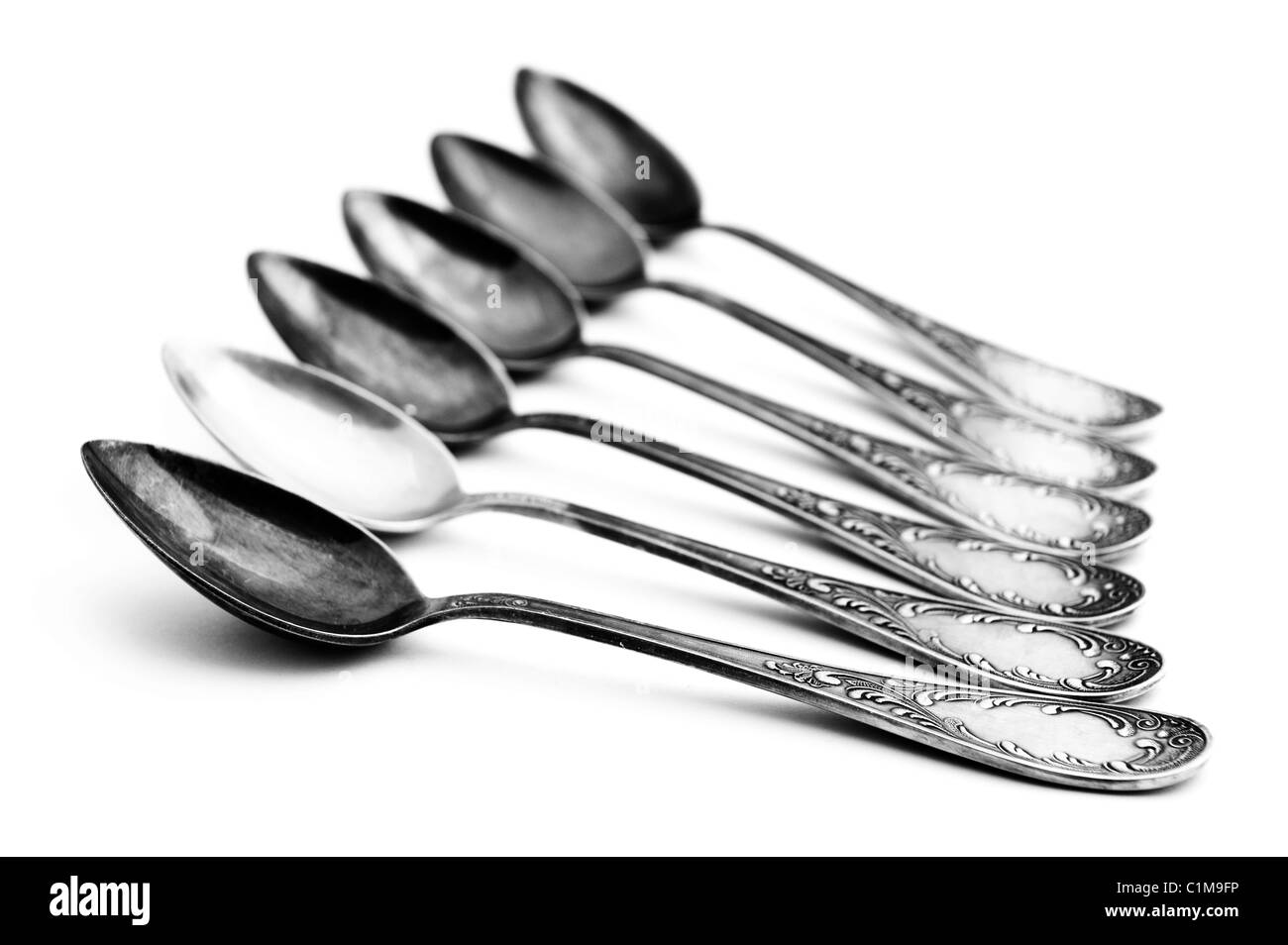 object on white - antique silver spoon Stock Photo