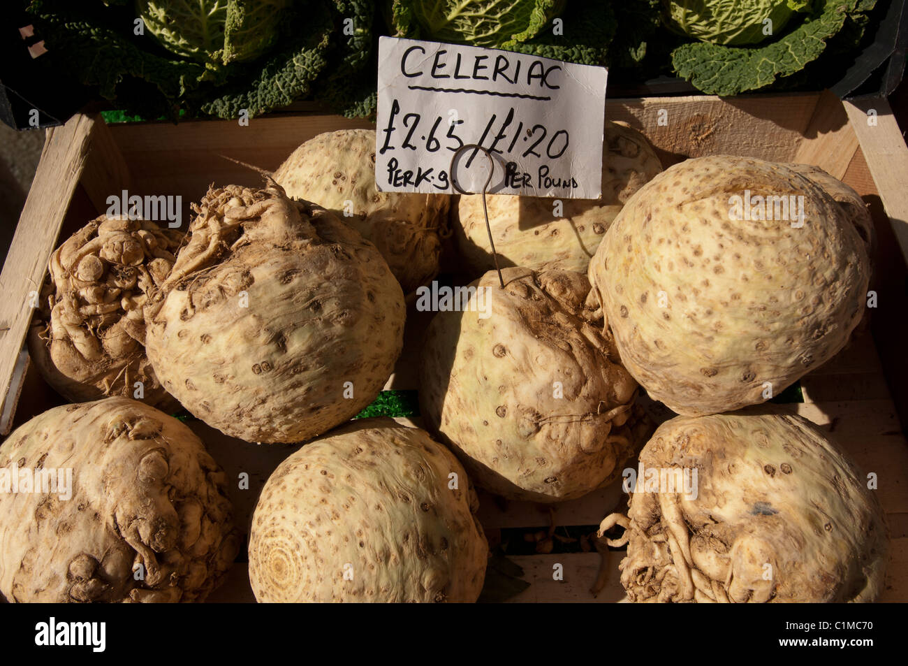Celeriac root vegetable on sale in a greengrocers shop UK Stock Photo