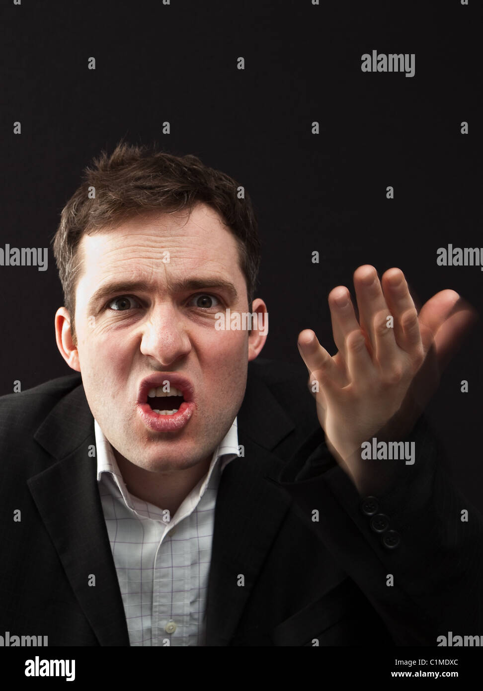 Angry young business man Stock Photo