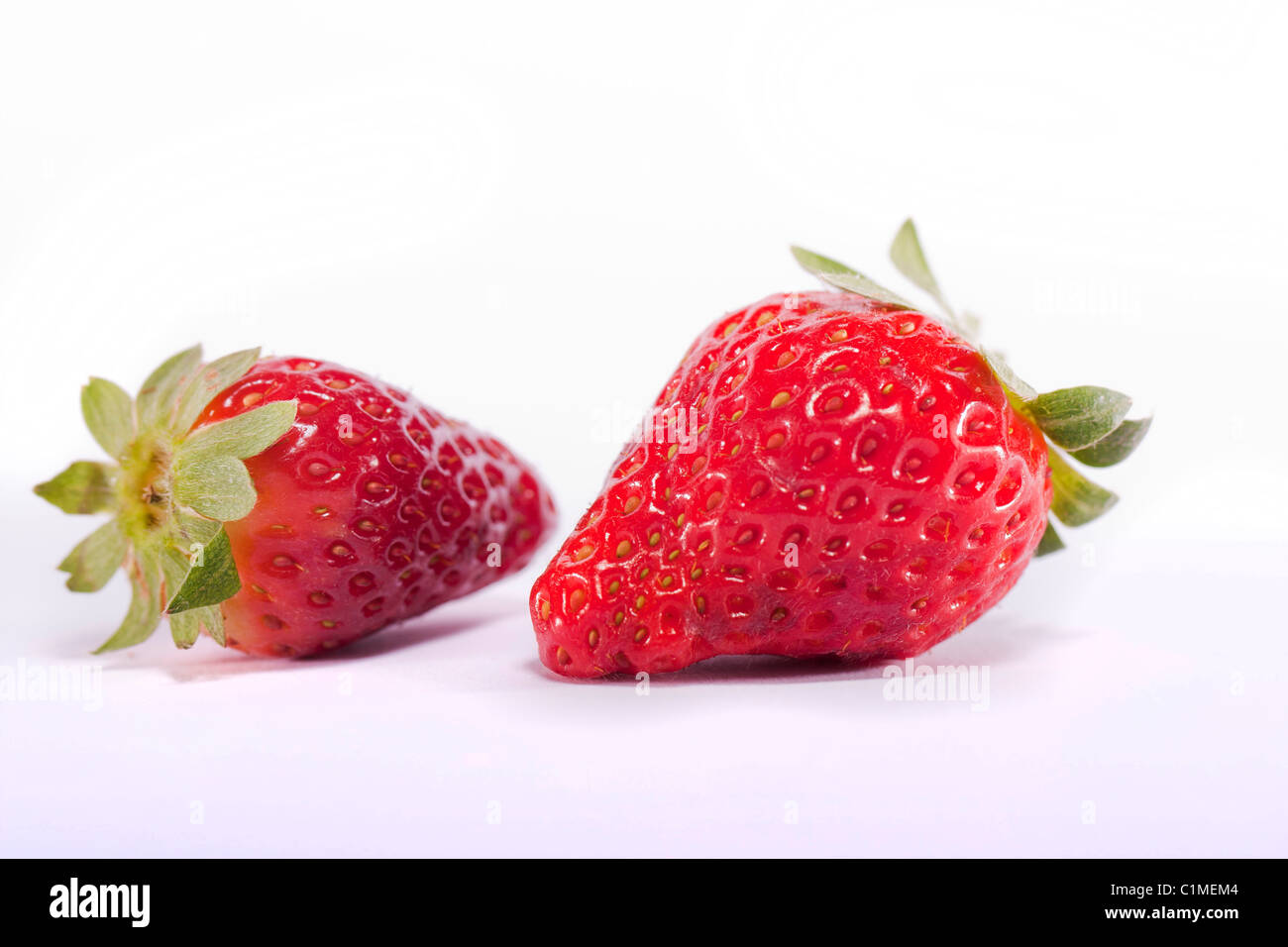 Close view of strawberries fruits isolated on a white background Stock ...