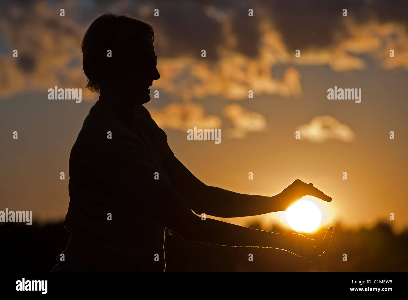 Silhouette against Sun, Woman Holding Sun Stock Photo - Alamy