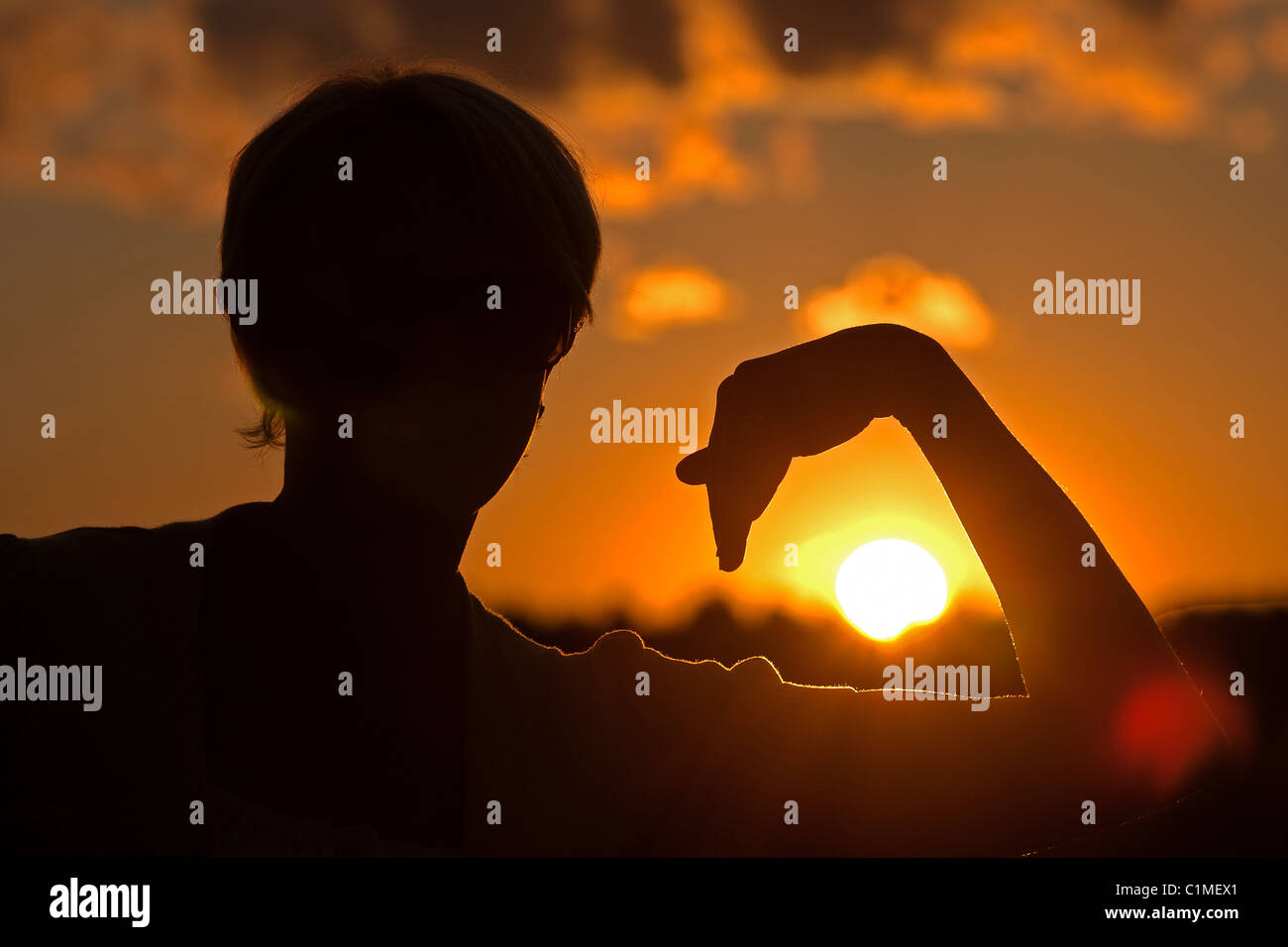 Silhouette against Sun, Woman Holding Sun Stock Photo - Alamy