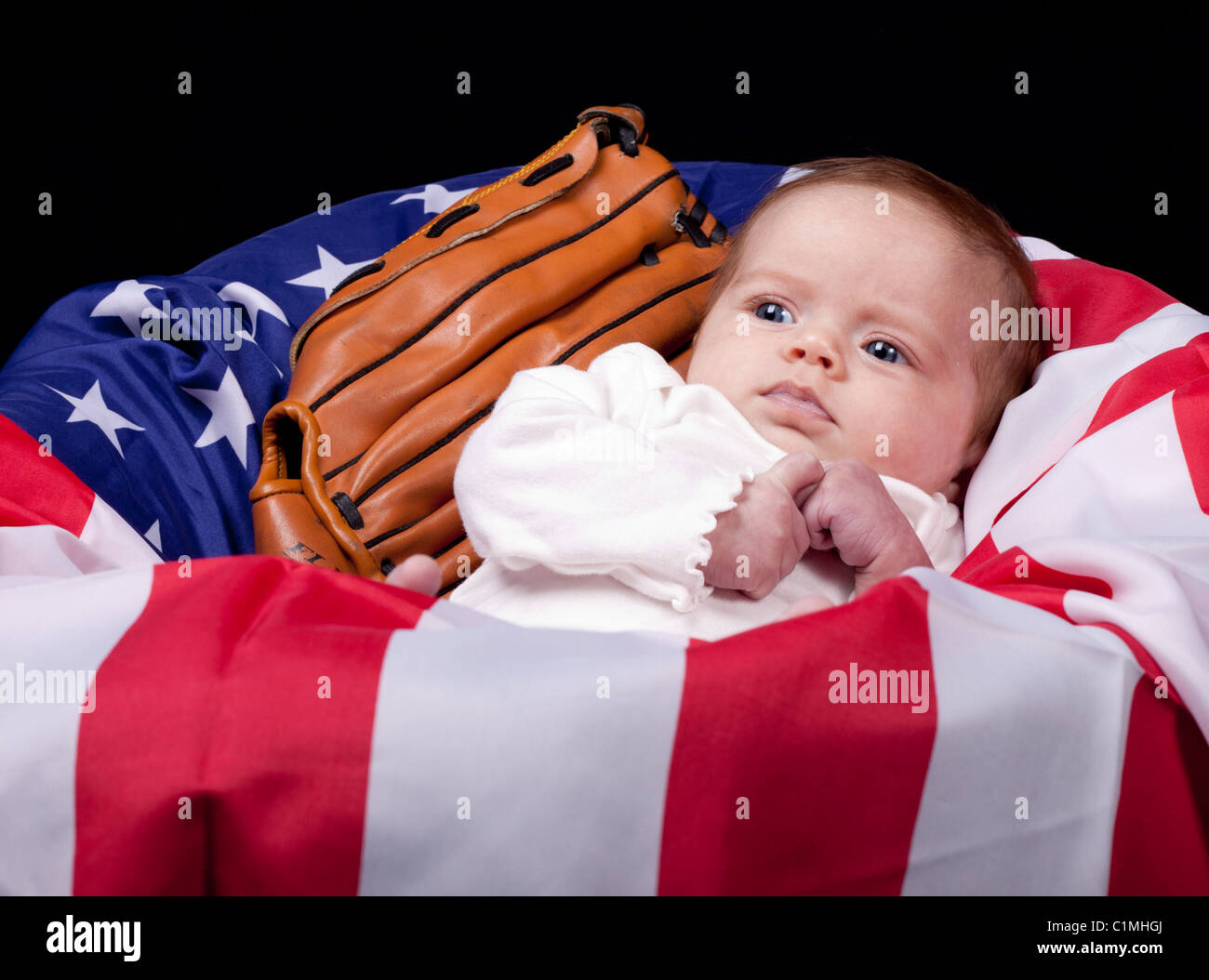 A newborn American baby looks aside. Stock Photo