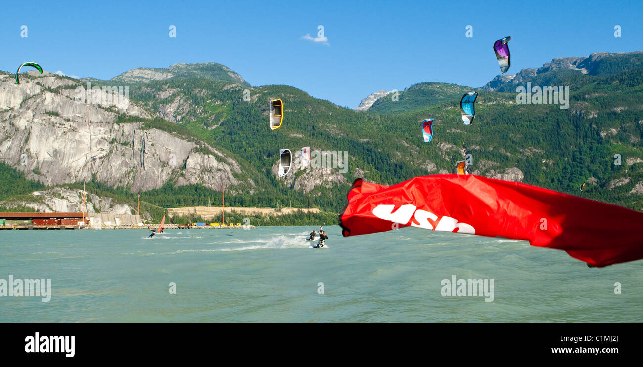 Kiteboarders jockey for position at the start of a kiteboard race. Stock Photo