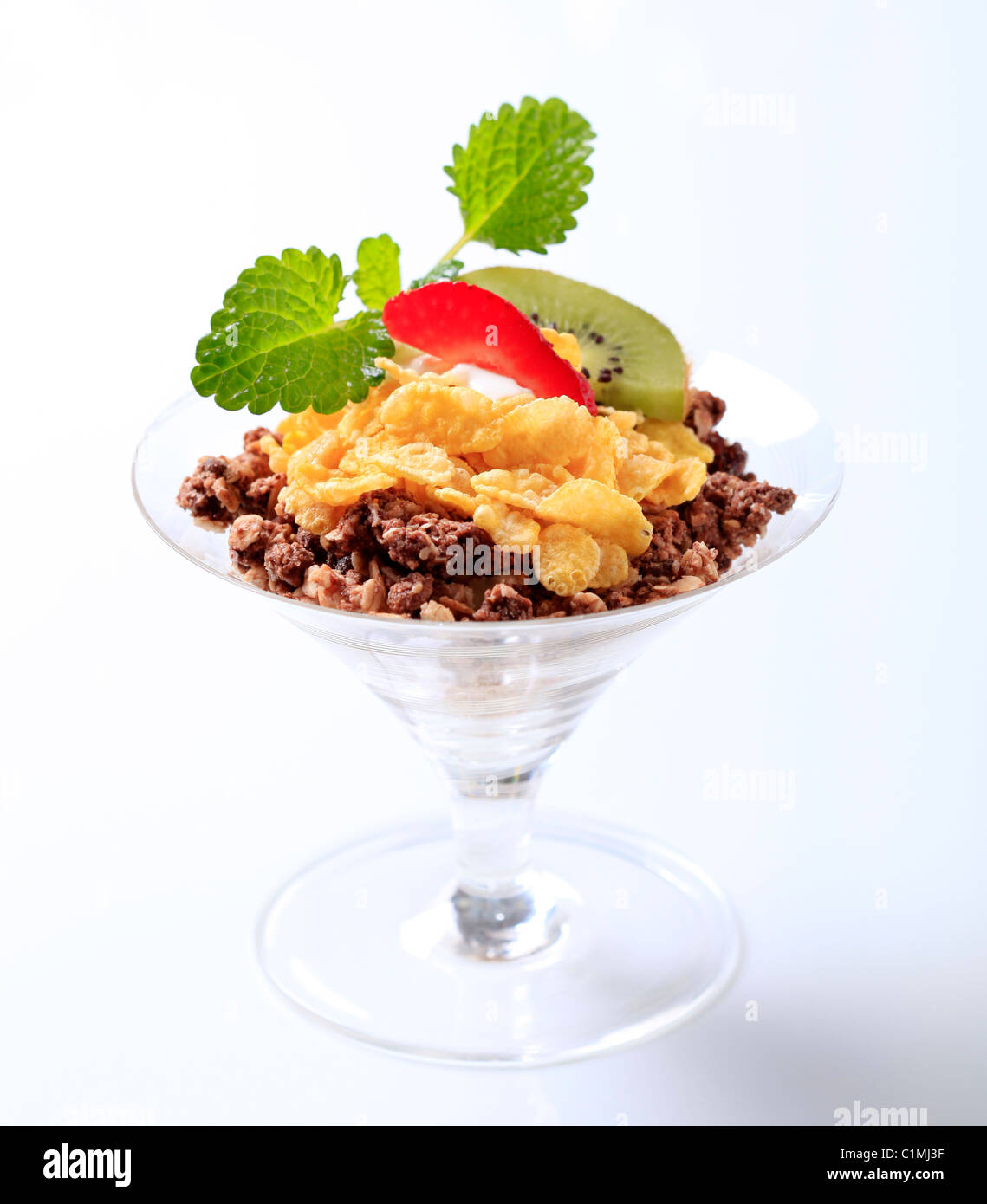 Chocolate granola and corn flakes topped with fruit Stock Photo Alamy