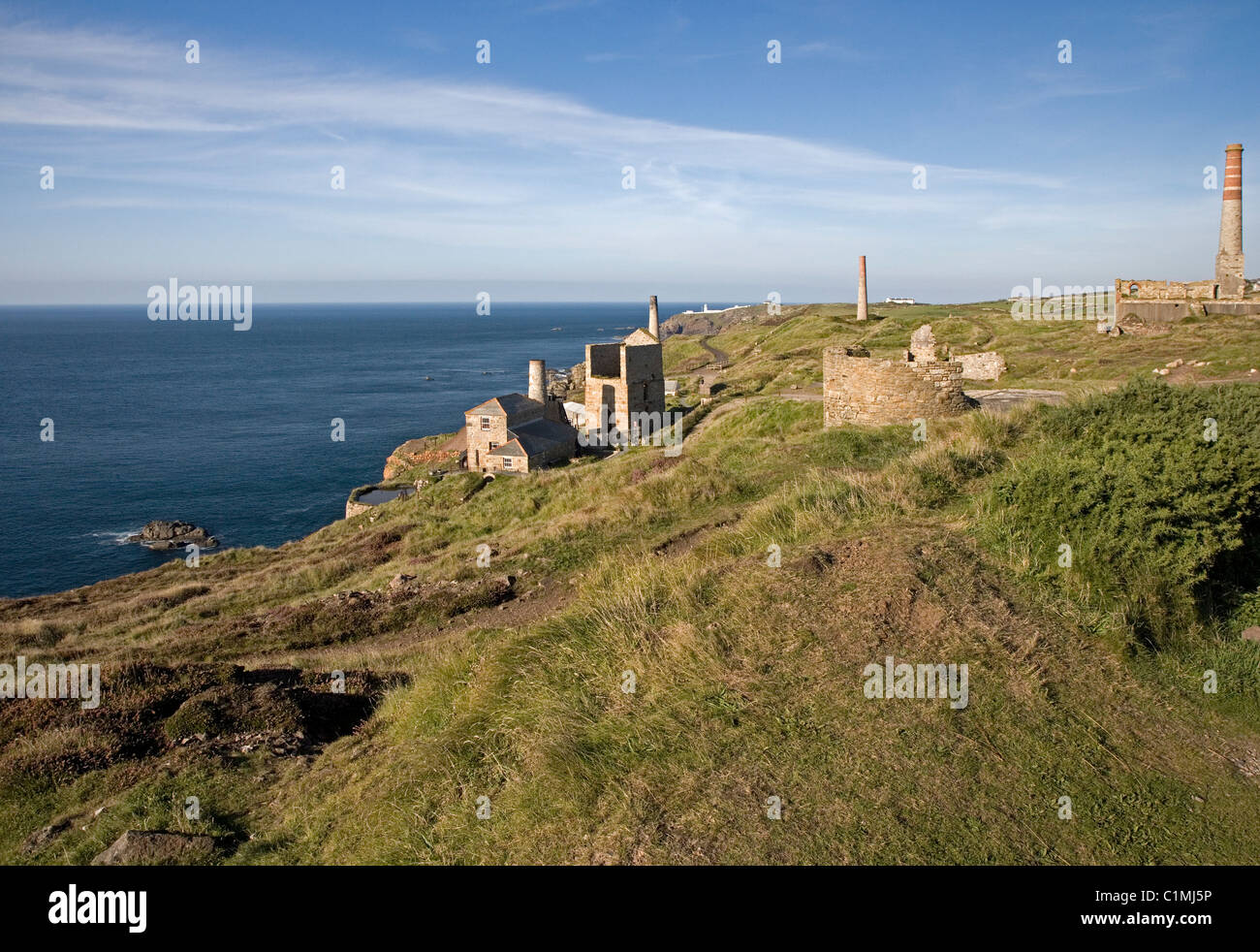 Old mine workings and ventilation shafts at tin mines near Pendeen St Just Cornwall Stock Photo