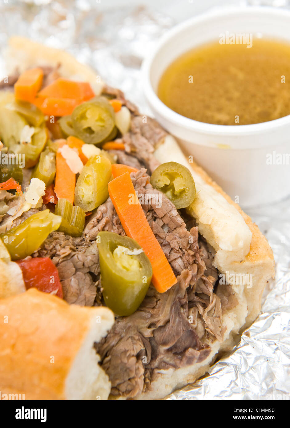 Chicago style Italian beef sandwich with giardiniera and dipping sauce