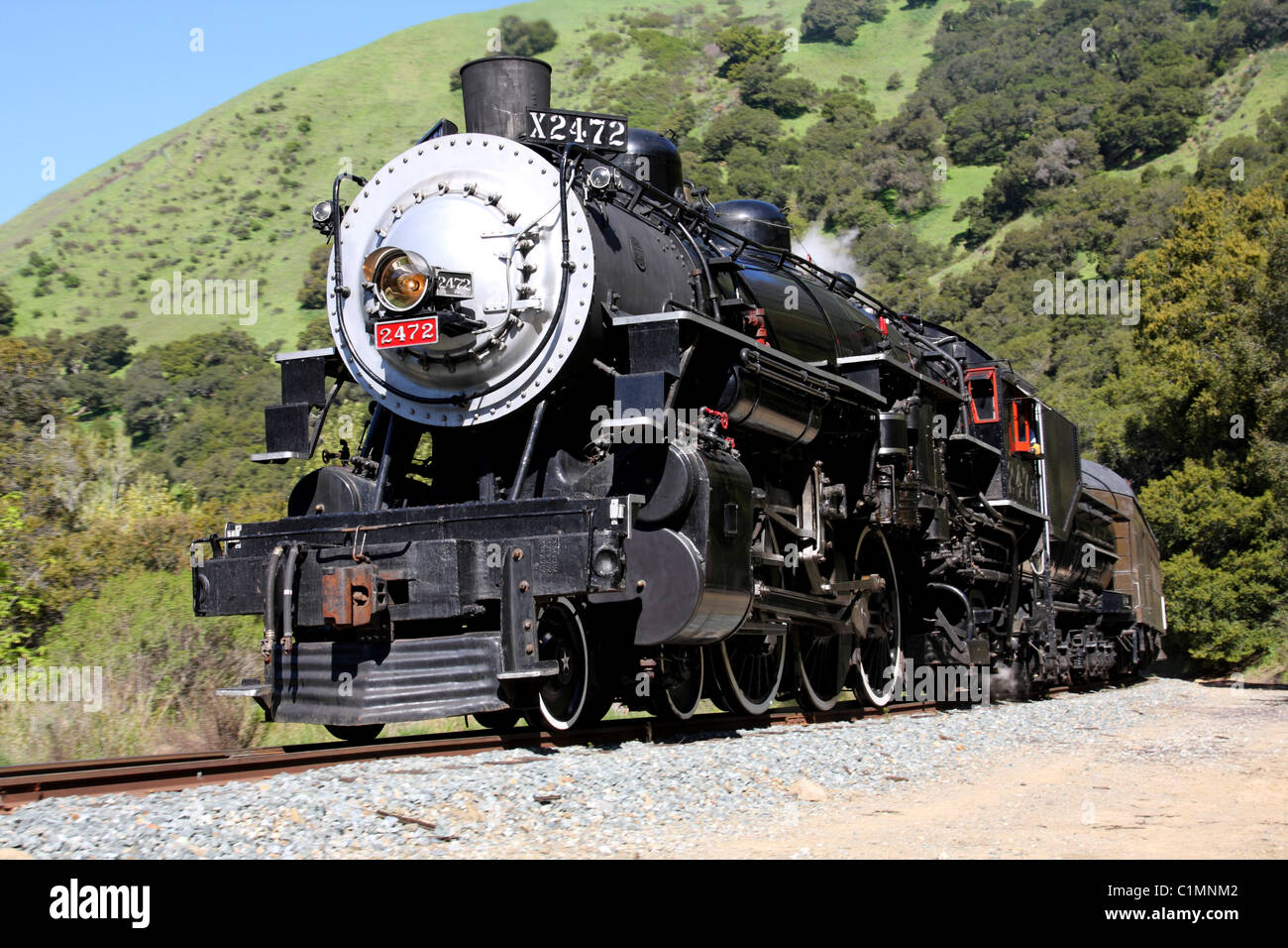 Southern Pacific Steam Locomotive #2472 running through Niles Canyon. Stock Photo