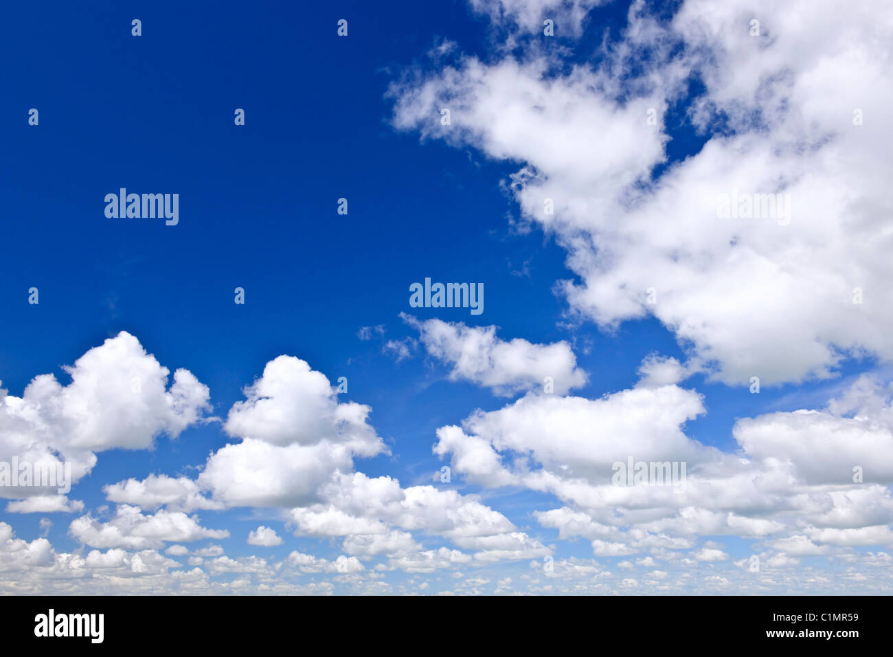 Background of blue sky with white cumulus clouds Stock Photo - Alamy