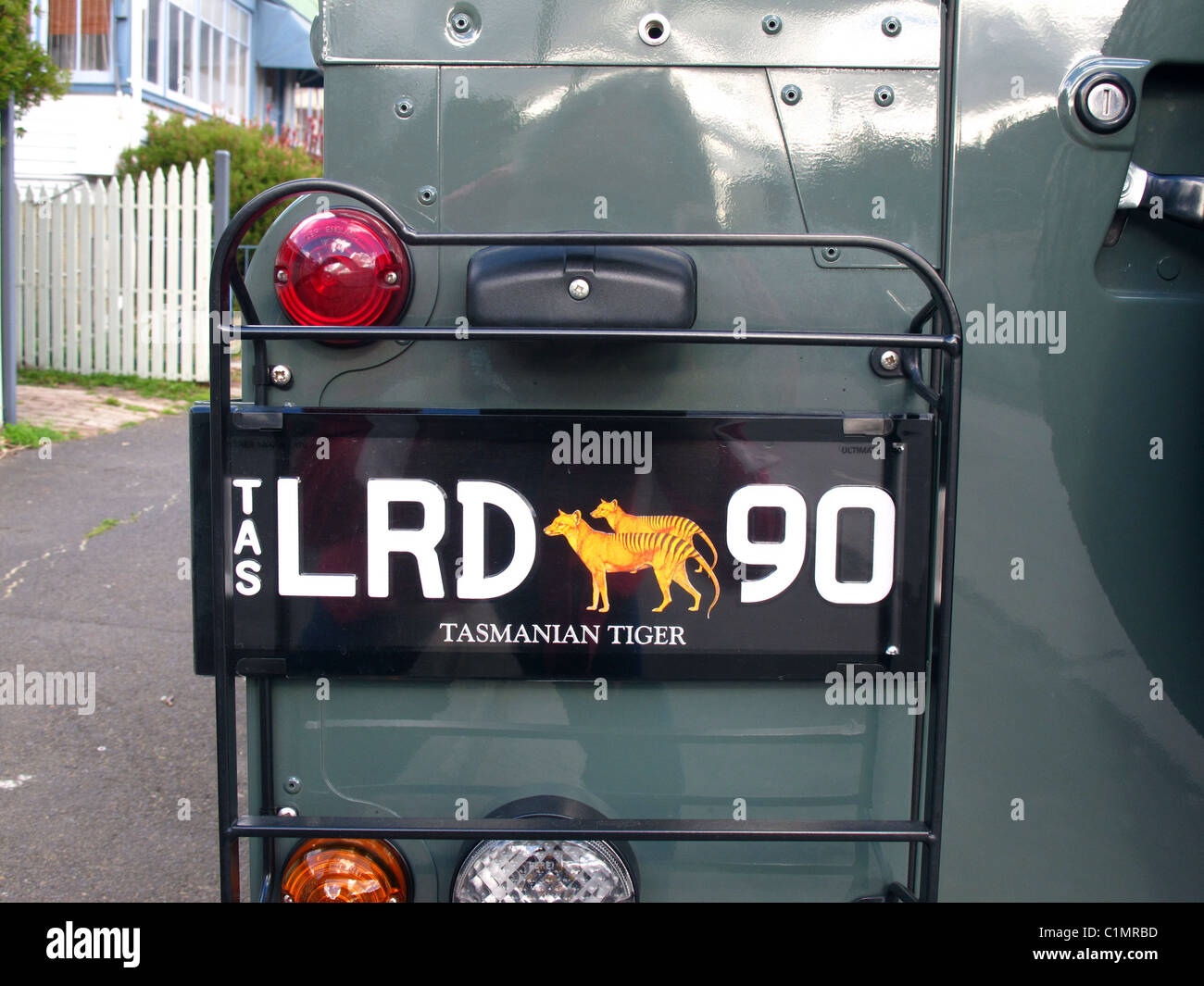 Unique Tasmanian number plate on a Land Rover Discovery depicting the thylacine also known as the Tasmanian Tiger Stock Photo