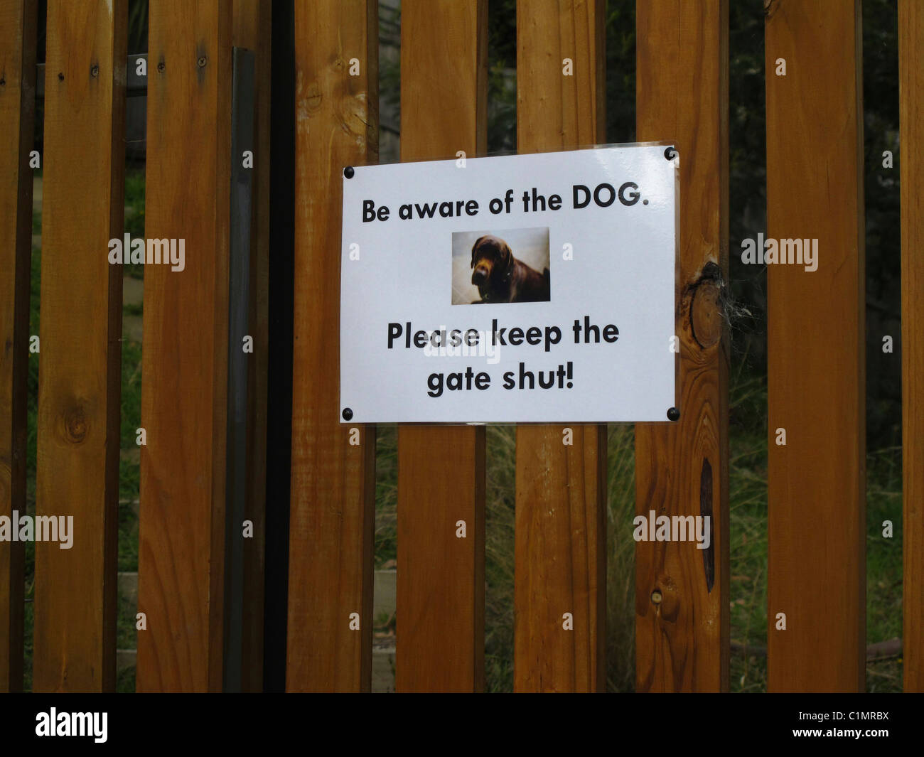 Sign warning 'be aware of the dog' Stock Photo