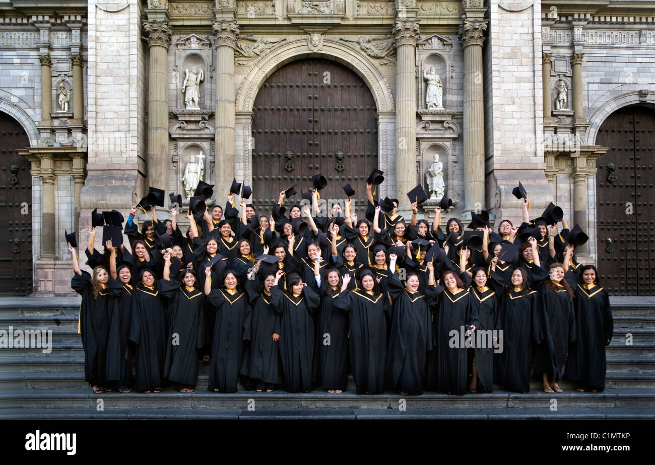 Group of college student have their picture taken in front of the Cathedral in plaza de Armas, Lima, Peru Stock Photo