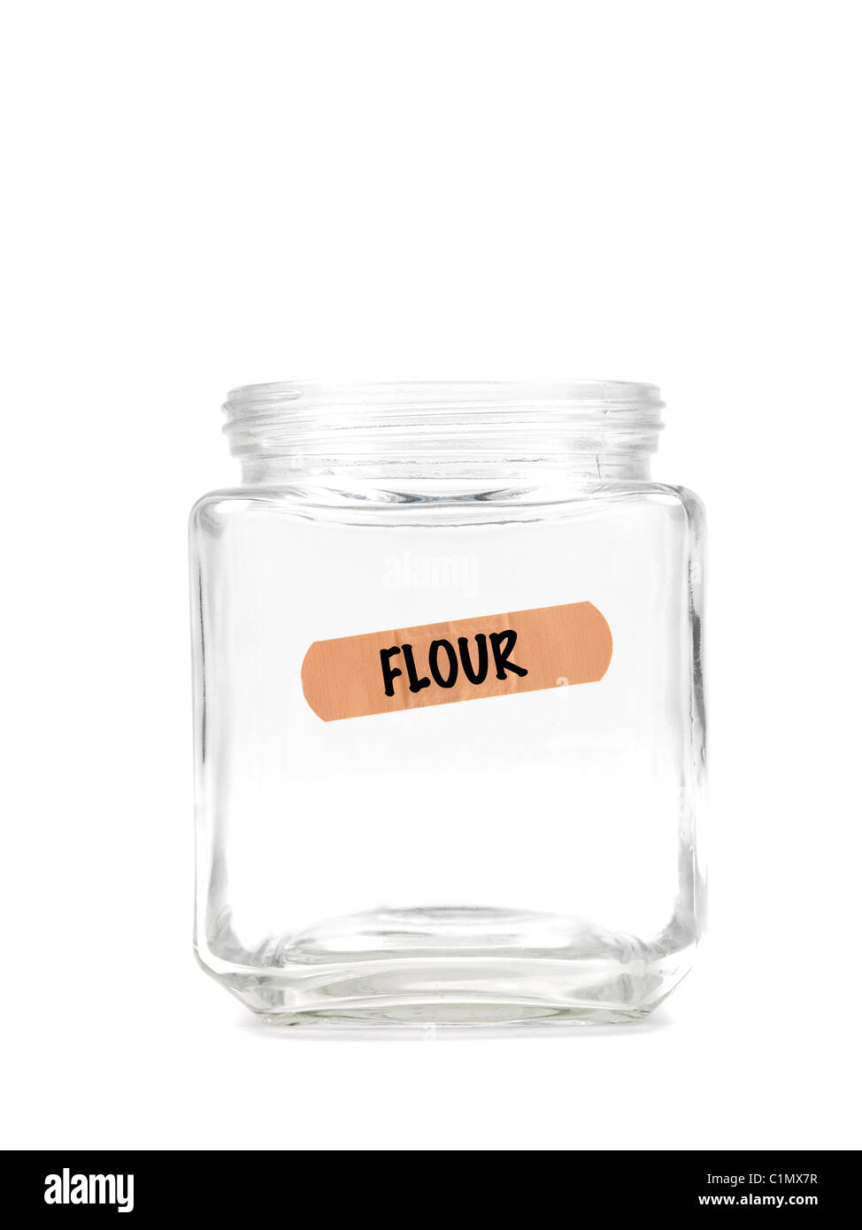 An empty jar with a flour label isolated against a white background Stock Photo