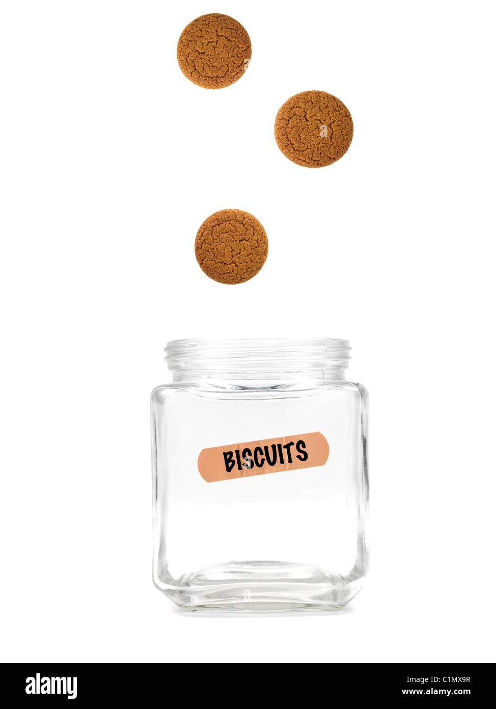 An empty jar with a biscuit label isolated against a white background Stock Photo