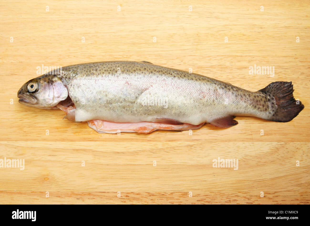 Fresh rainbow trout on a wooden board Stock Photo