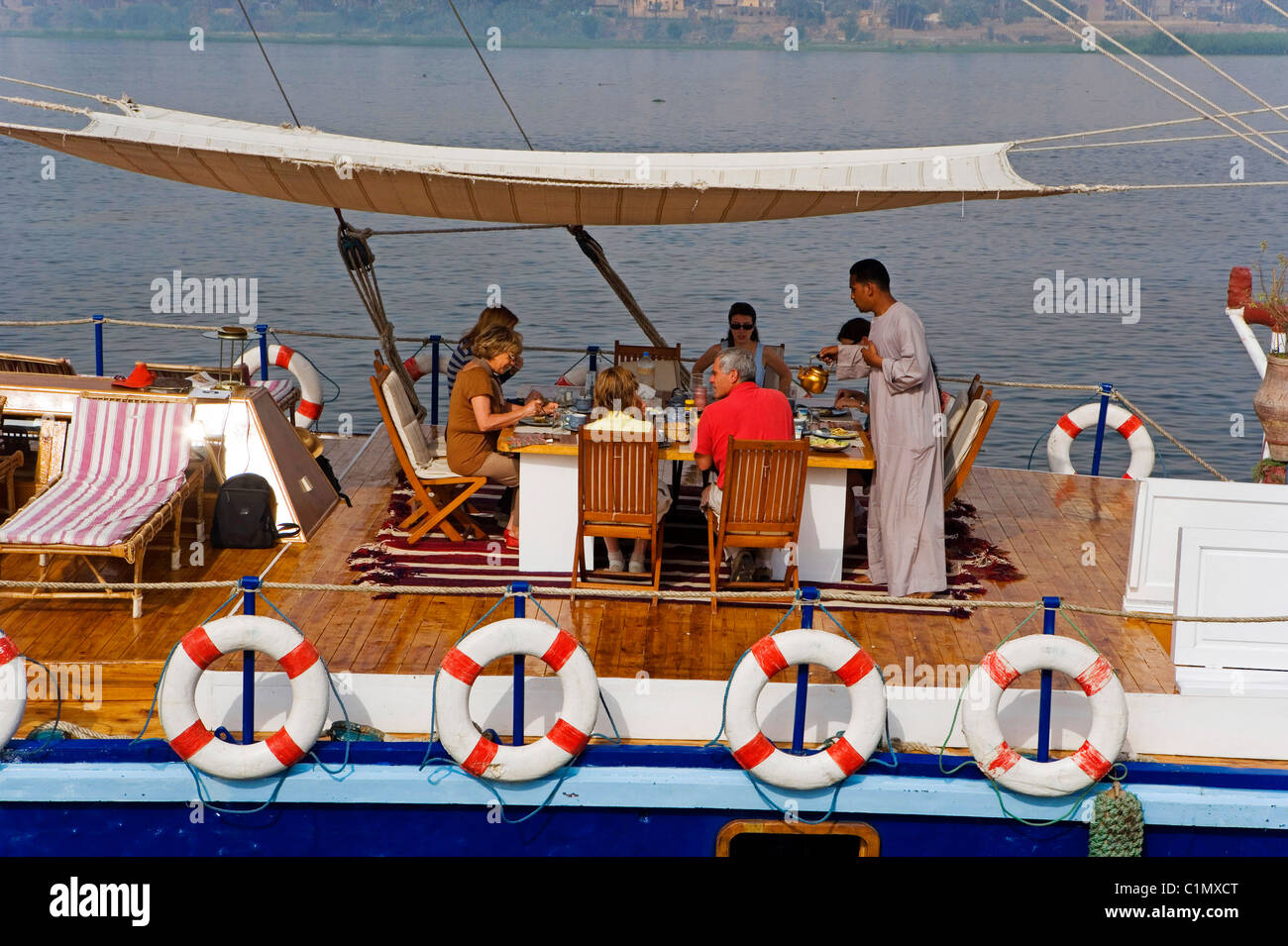 Egypt Upper Egypt Nile Valley near Luxor Sandal : boat with two sails  formerly used to transport stone block & then refitted Stock Photo - Alamy