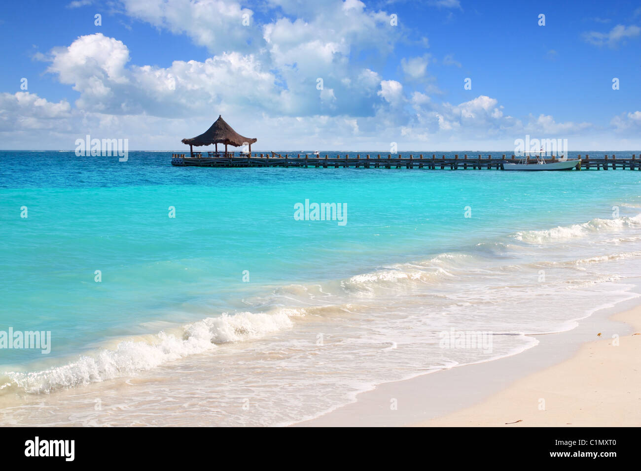 Caribbean sea truquoise beach pier hut Mayan Riviera Puerto Morelos Mexico Stock Photo