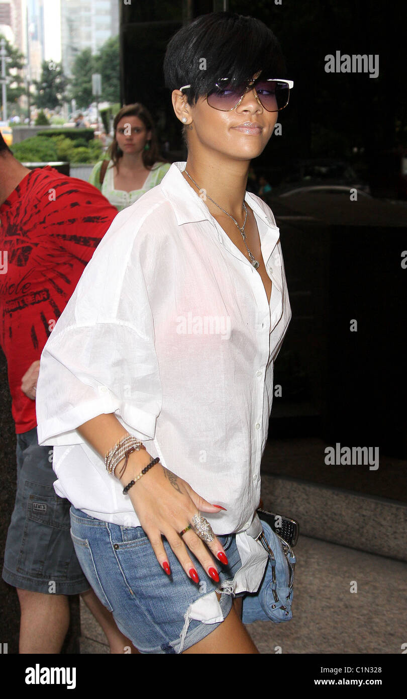 Rihanna arrives at her hotel wearing loose blouse, denim shorts and white  flat shoes New York City, USA - 29.06.09 Stock Photo - Alamy