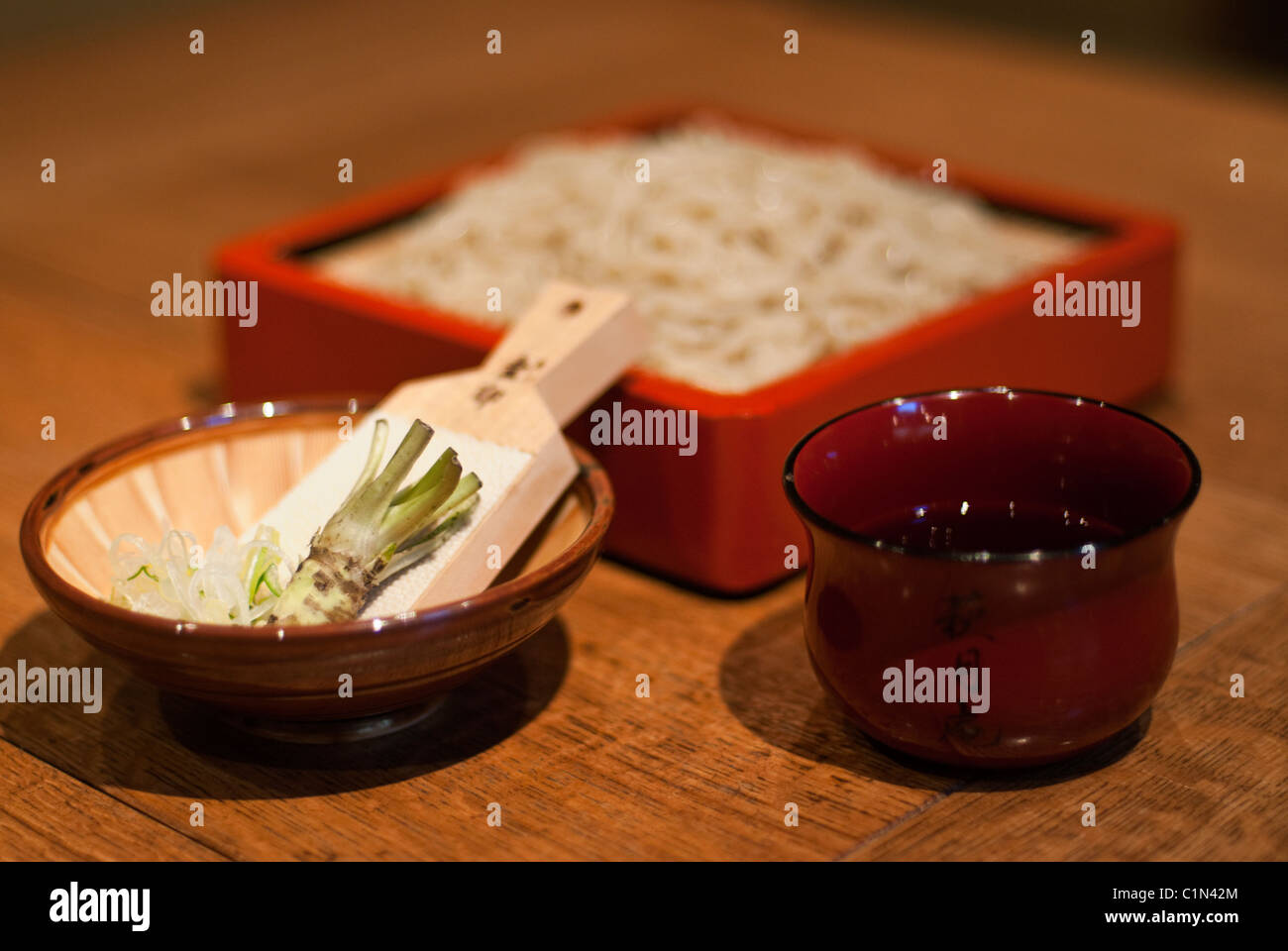Zaru soba noodles (cool buckwheat noodles) with fresh wasabi root and dipping sauce. Stock Photo