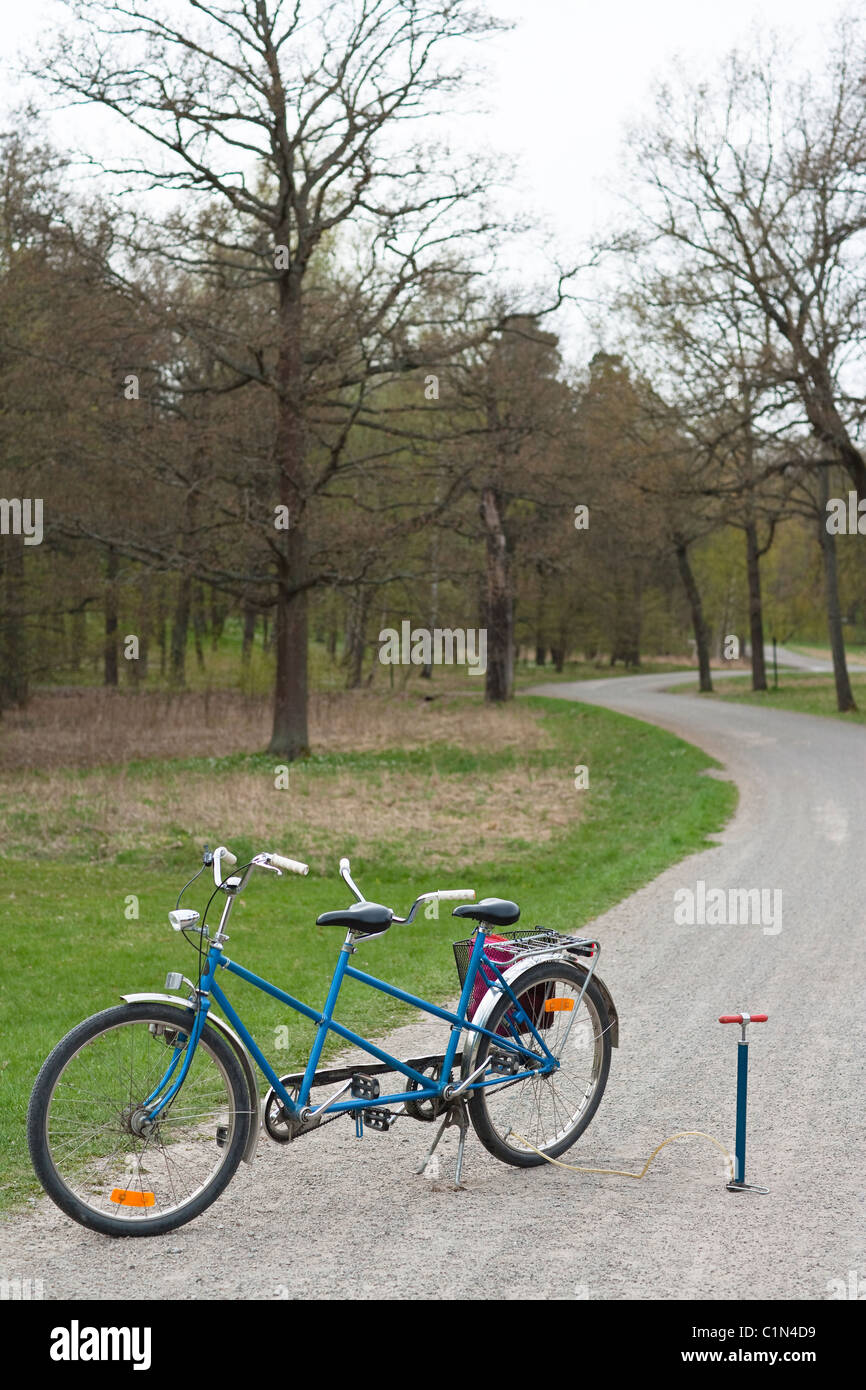 Tandem bike on path Stock Photo