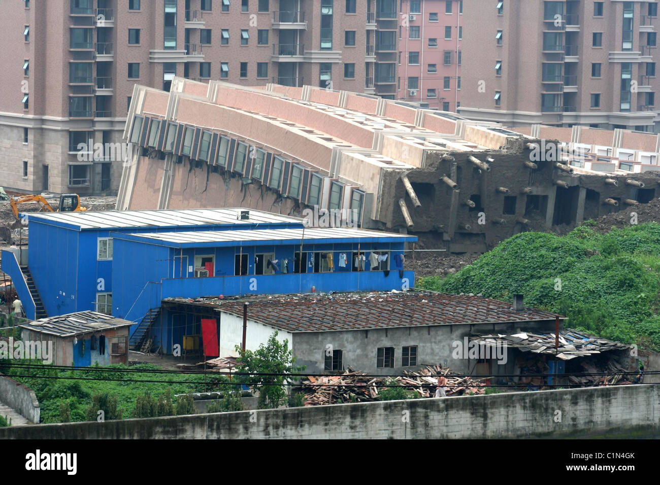 Apartment complex collapses in China Nine officials are being held by