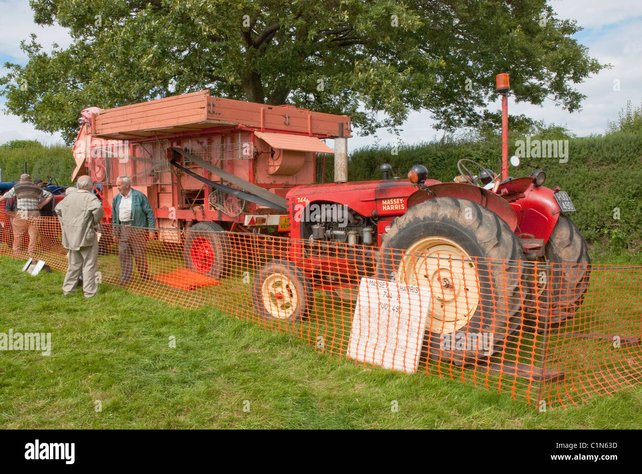 Demonstration of old fashioned threshing machine and tractor at the