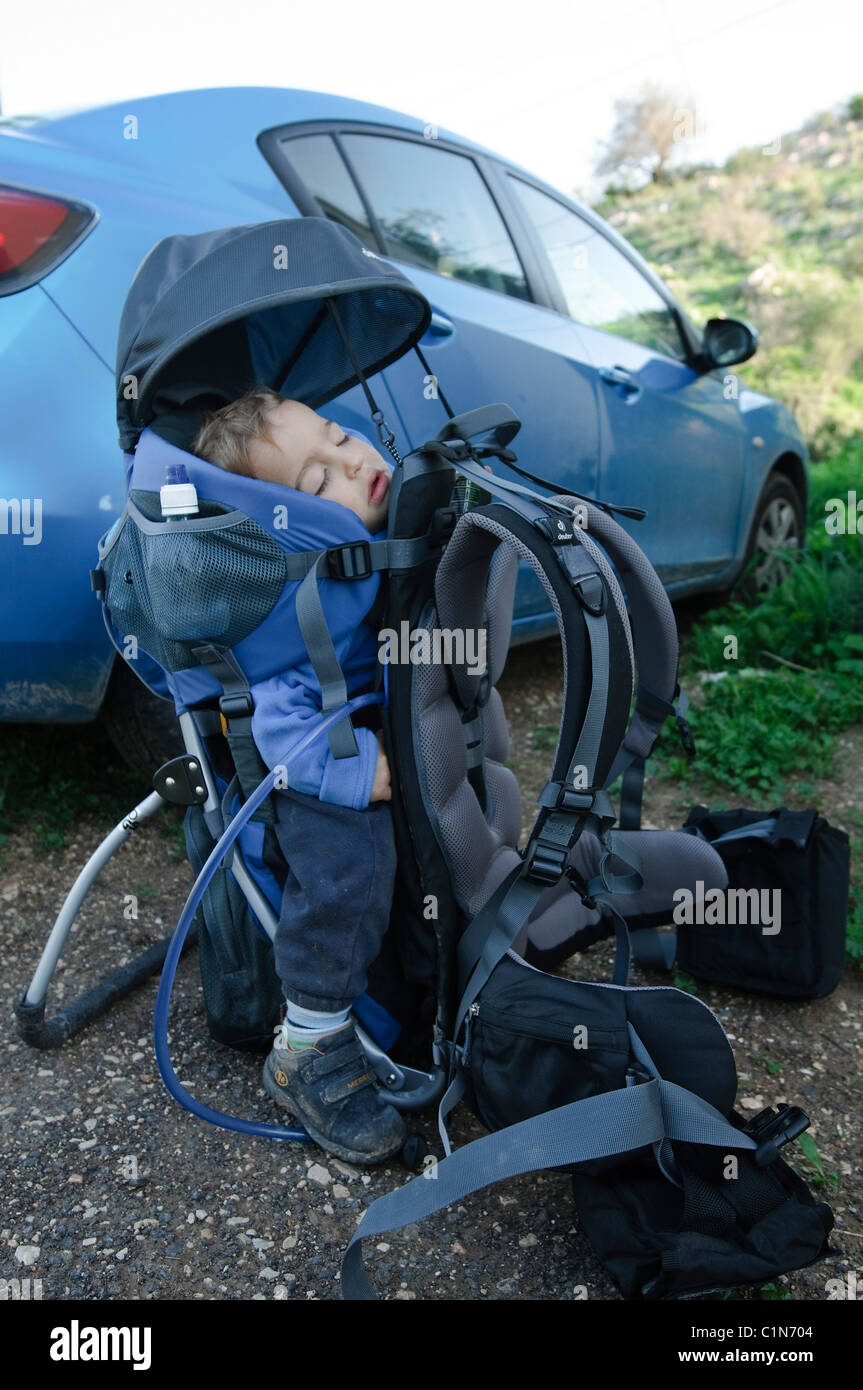 Baby asleep in a backpack baby carrier Stock Photo Alamy