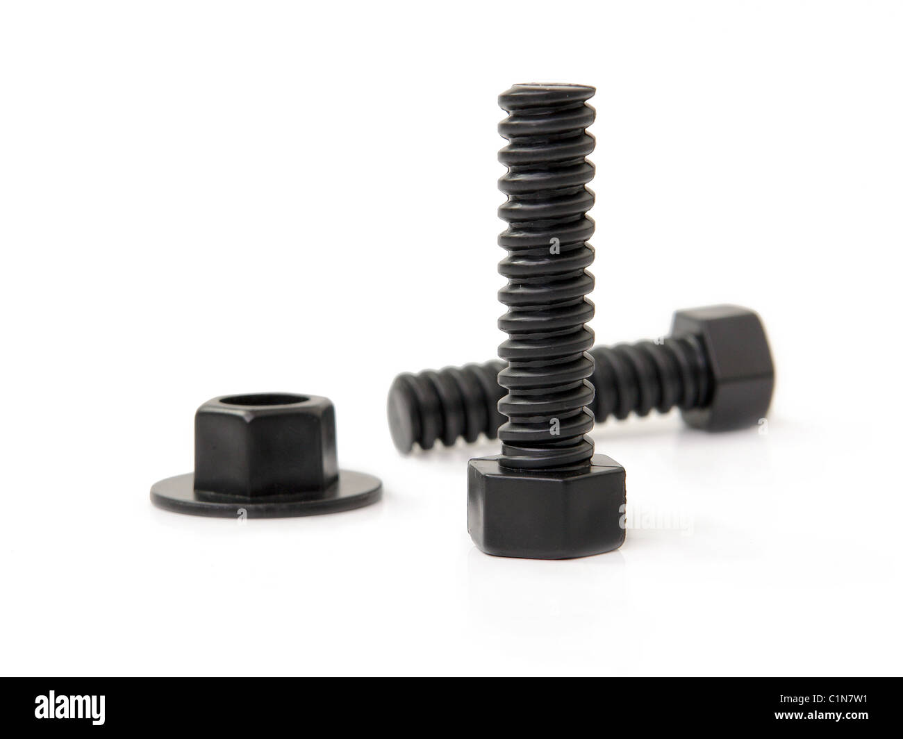 Black bolts and nut over white background Stock Photo