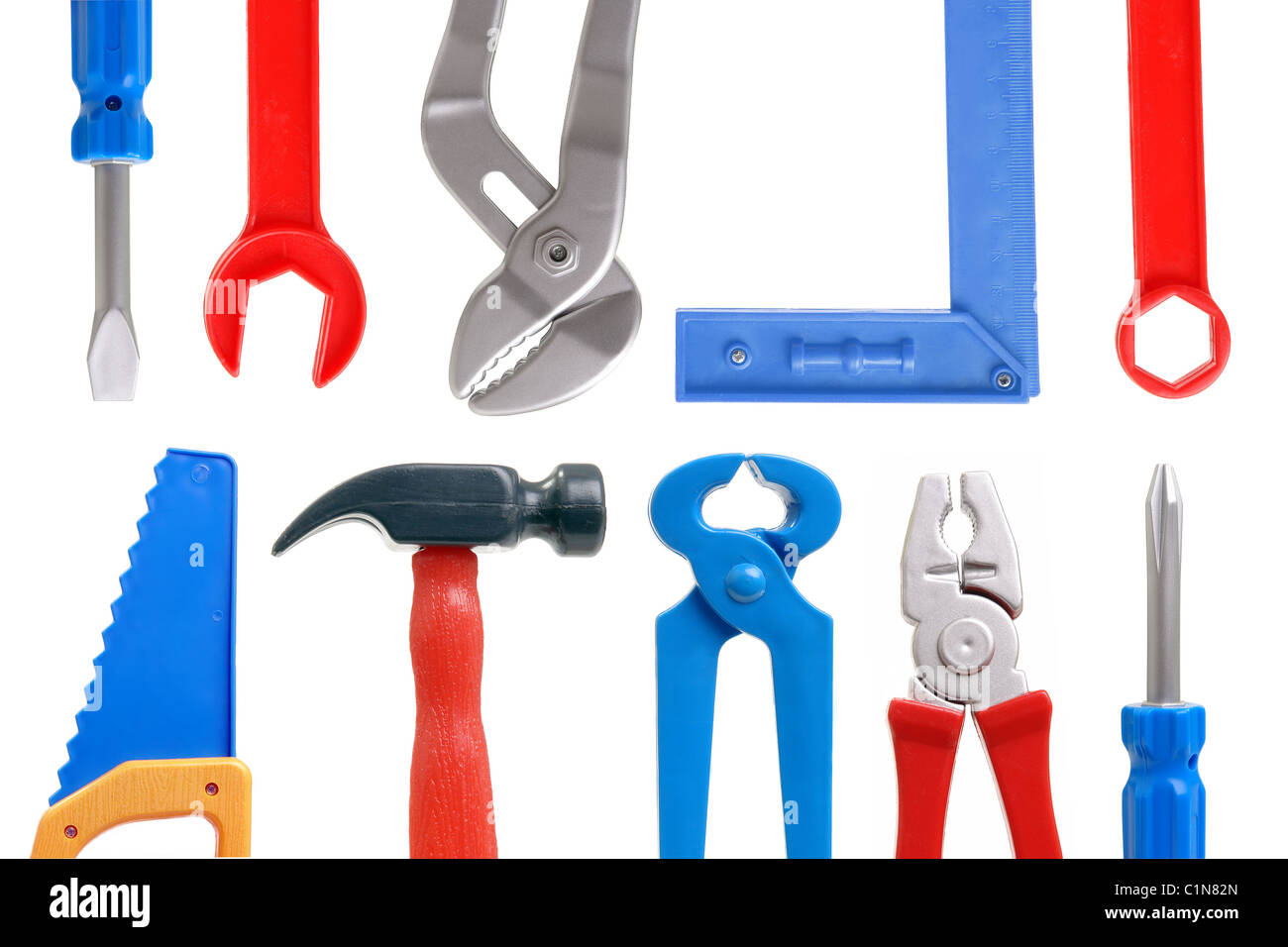 Set of plastic toy tools over white background Stock Photo