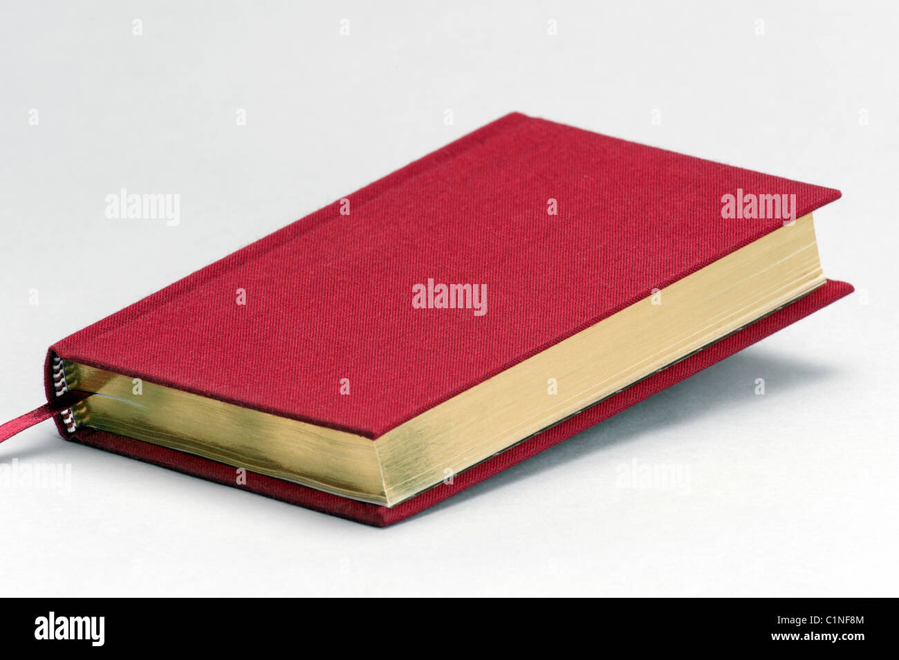 Red plain book with gold pages Stock Photo