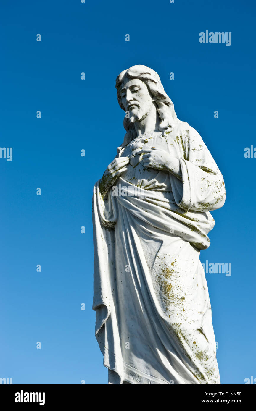 A statue of the Sacred Heart of Jesus in an Irish cemetery Stock Photo