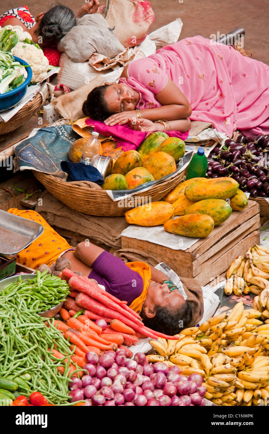 Indoor produce market with sleeping clerks in Panaji, Goa. Stock Photo