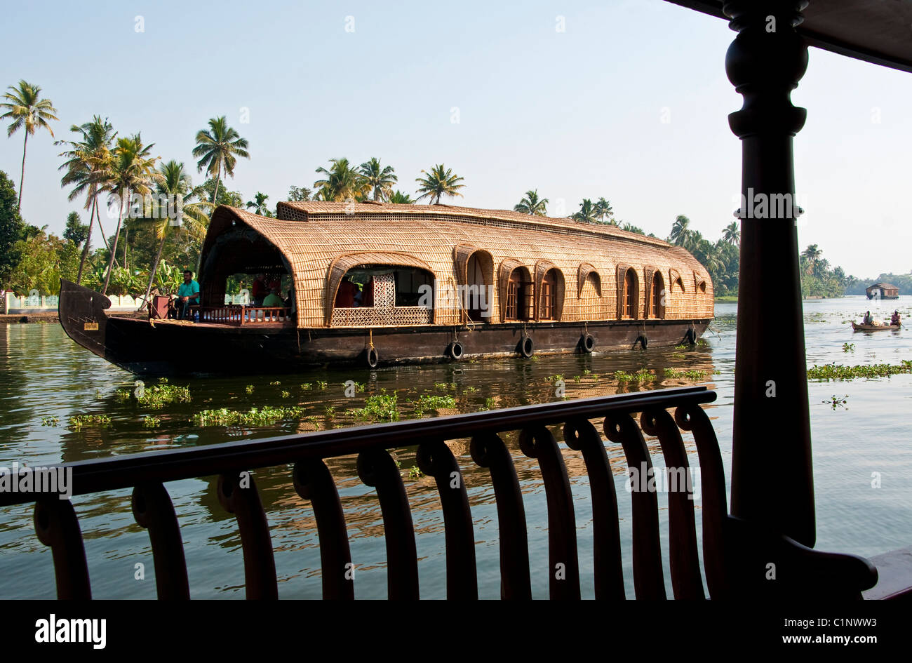 Houseboat with two cabins for passengers cruising the tropical Kerala Backwaters on the Malabar coast of South India. Stock Photo