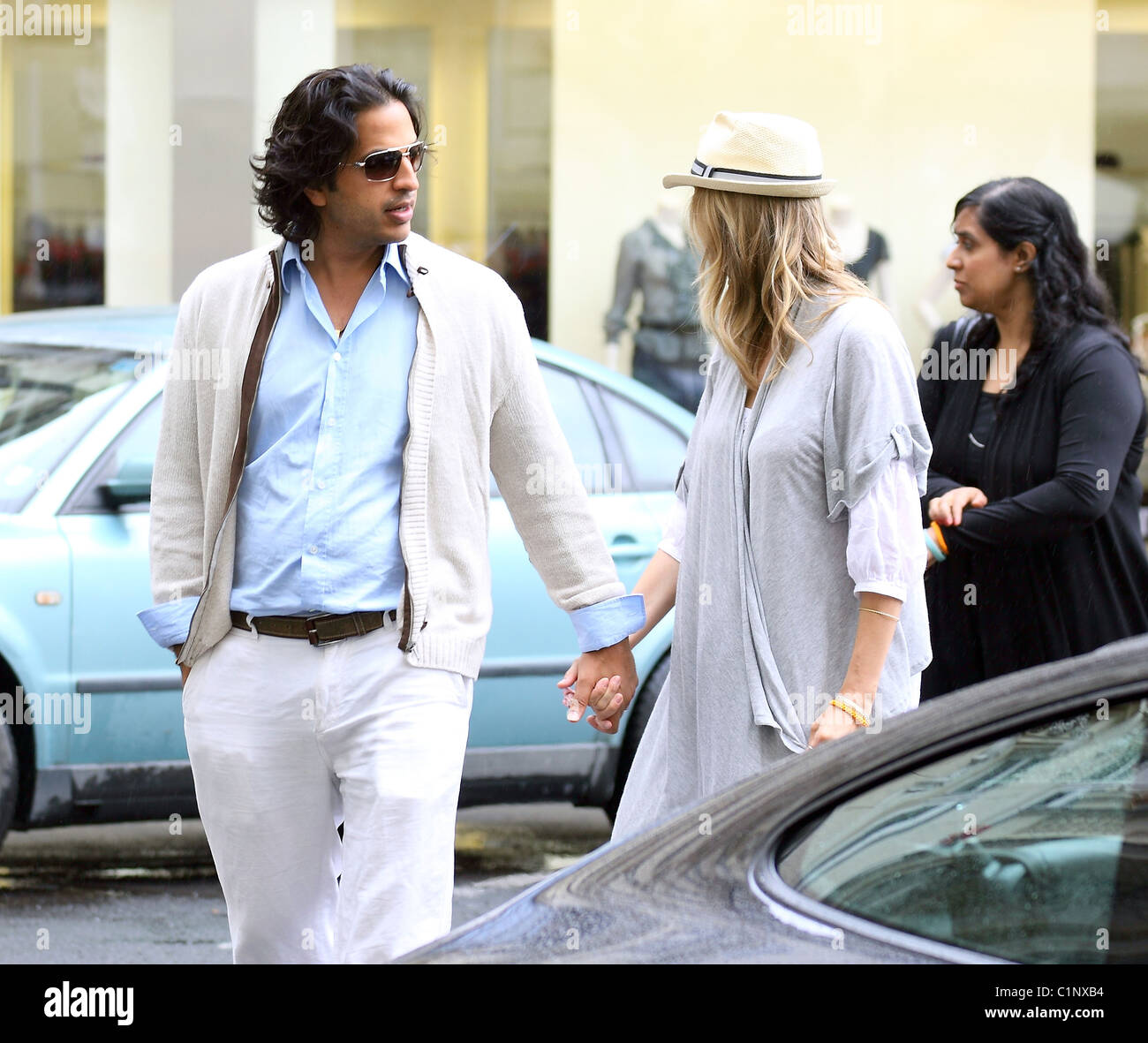 Model Helena Houdova and husband Omar Amanat take a walk through the